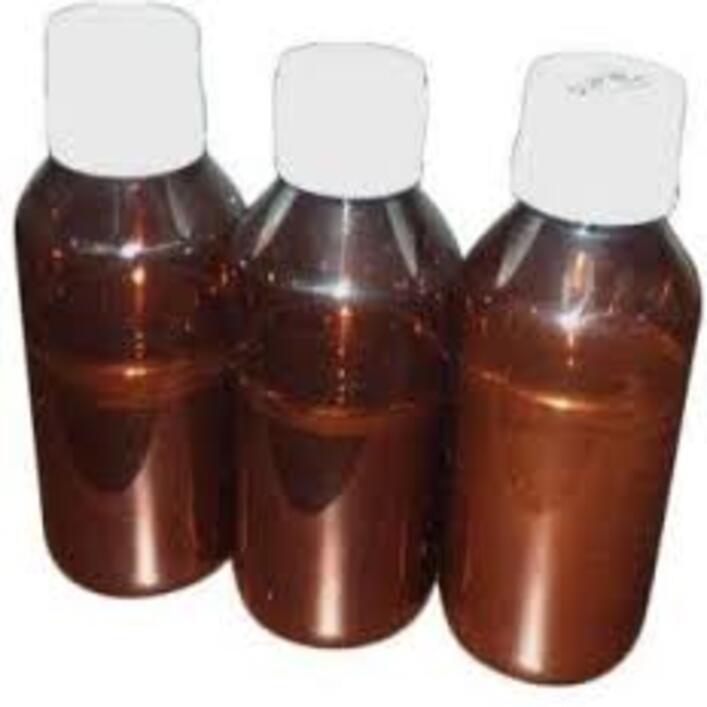 Close-up of vibrant Pure Red Liquid Mercury with reflective surface in glass vial